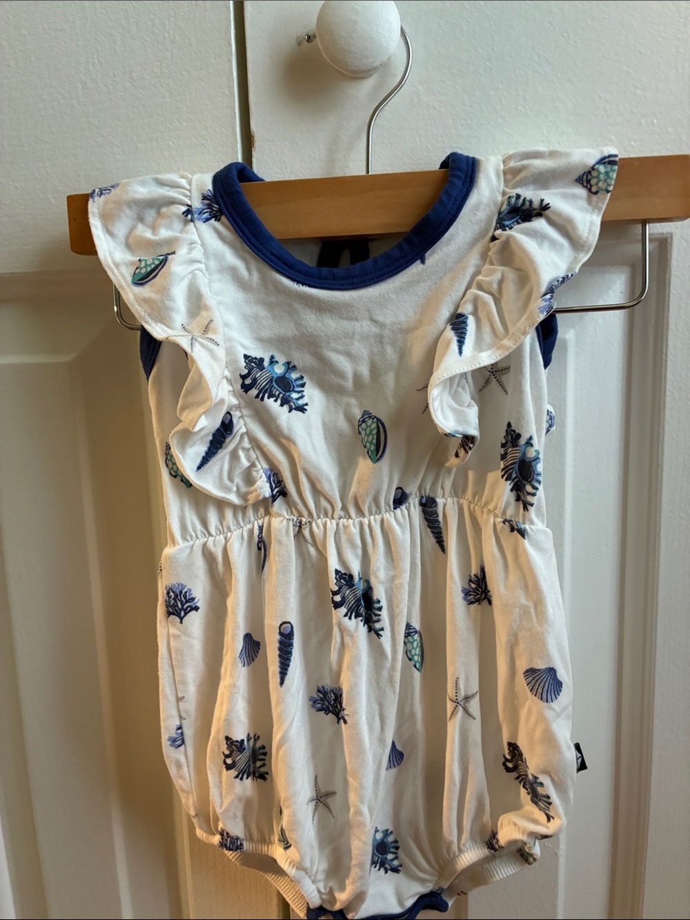 Kyte BABY White and Navy Seashell Ruffle Bodysuit